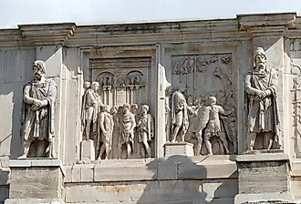 Rome, two left relief panels of the south attic of the triumphal Arch of Constantine, depicting an enemy chieftain before the emperor, and a scene with other prisoners. Image credit MonikaKL via Shutterstock