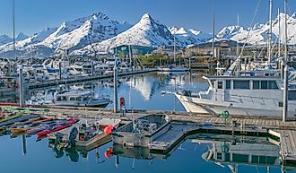 View of the Chugach Mountains and Valdez boat harbor in Valdez, Alaska.