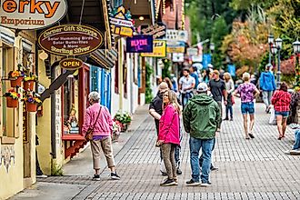 Helen, USA - October 5, 2021: Helen, Georgia Bavarian village town traditional architecture building with many people tourists