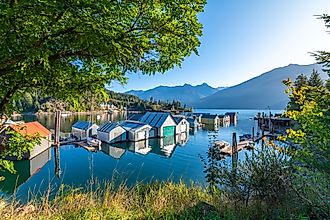 Early morning sunlight on the shipyard, marina and dock on Kootenay Lake in Kaslo Bay, in Kaslo, British Columbia.