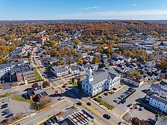 Milford Town Hall aerial view in fall at 52 Main Street in historic town center of Milford, Massachusetts.