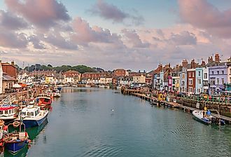Boats at sunset in Weymouth, Dorset, UK.