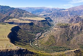 Drone view of Debed river gorge, Alaverdi town and Sanahin village on sunny summer day. Lori Province, Armenia. Image credit Kirill Skorobogatko via Shutterstock.