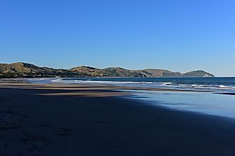 Wainui Beach with great view of nearby mountain ridges in Gisborne, Hawkes Bay, New Zealand. 