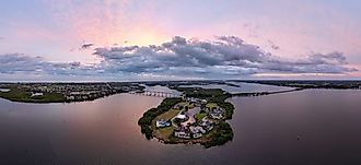Panoramic aerial view of the Indian River Lagoon at sunrise with Wabasso Island and the Vero Beach coastline in Florida.