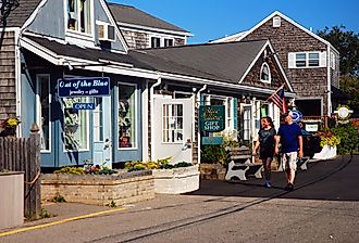 A couple browses the small boutiques stores of Perkins Cove in Ogunquit, Maine.