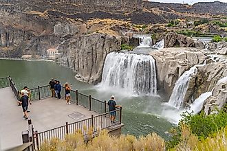 Twin Falls, ID, USA - August 5, 2022: Shoshone Falls, or Niagara of the West, in Twin Falls, Idaho. Observation deck with tourists. Editorial Credit: Iv-olga via Shutterstock.