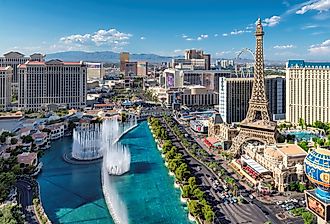 Aerial view of fountain show and Las Vegas strip in Nevada at sunset.