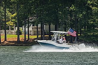 Greensboro, Georgia: Boaters on fishing boat enjoy summer day on the lake, via The Toidi / Shutterstock.com