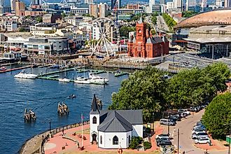 Cardiff, Wales: Aerial drone view of Cardiff Bay showing the Norwegian Church and Pierhead Building.