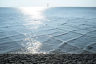 A cross sea is caused by two sets of waves converging at different angles.