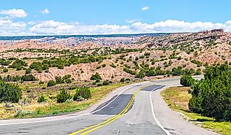 Landscape scenic drive from car point of view during summer from High Road to Taos famous trip near Chimayo and Santa Fe in New Mexico. Andriy Blokhin via Shutterstock.