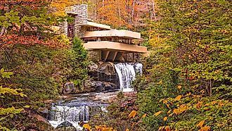 Fallingwater, the iconic house designed by Frank Lloyd Wright, perched over Bear Run waterfall in Mill Run, Pennsylvania. Editorial credit: Sean Pavone / Shutterstock.com