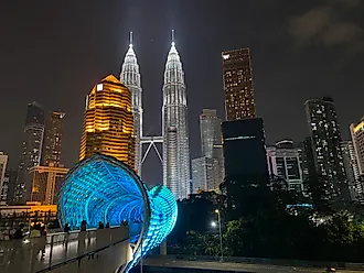 The iconic Petronas Twin Towers light up Kuala Lumpur’s skyline. Photo credit: Andrew Douglas