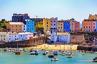 Beautiful summer sunshine and warm weather drew visitors to the beach Tenby, Wales, via Lukasz Pajor / Shutterstock.com