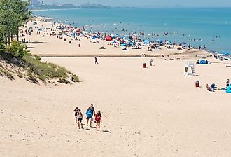 Beach scene on a sunny day at Indiana Dunes State Beach, Lake Michigan. Image credit HPK Images via Shutterstock
