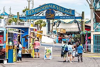 People walk and shop at the Harborwalk Village in Destin, Florida. Editorial credit: Andriy Blokhin / Shutterstock.com