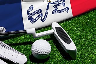 Golf ball, club and flag of Iowa for a golf championship in Iowa. Via Shutterstock / Bermix Studio.