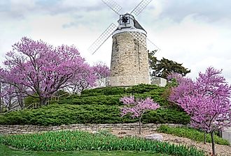 A windmill surrounded by beautiful foliage in Wamego, Kansas.