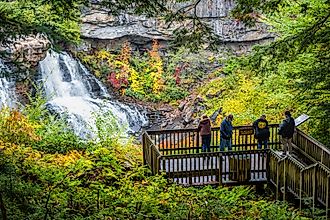 Visitors enjoying the sight of the Blackwater Falls at the Blackwater Falls State Park. Editorial credit: Kristi Blokhin / Shutterstock.com