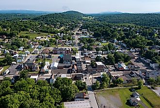 Aerial view of Hancock, Maryland and the forest and mountains near the Potomac River.