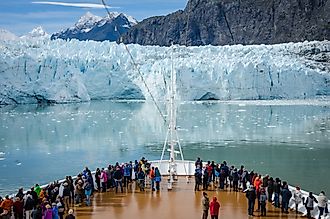 Cruise ship passengers get a close-up view of the majestic glaciers at the Glacier Bay National Park and Preserve, Alaska. Image credit: lembi / Shutterstock.com.