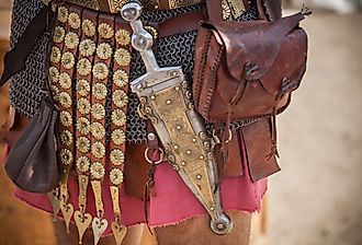 Historical reenactment of a Centurion girding a pugio, a dagger used by Roman soldiers as a sidearm.
