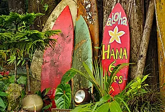 Welcome sign on a surfboard on the way to Hana, Hawaii.