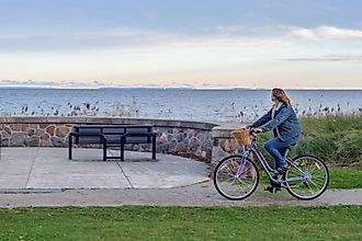 A bicyclist cruises along the Lake Superior shoreline.
