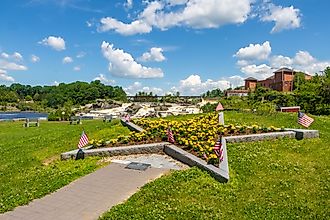 Gold Star Mothers Memorial in Veterans Memorial Park with Lewiston Falls in the background. Editorial credit: Jennifer Yakey-Ault / Shutterstock.com