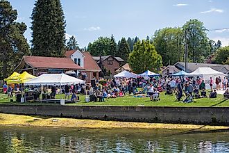 People enjoying the Maritime Gig Harbor Festival, via july7th / IStock.com