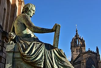 Statue of David Hume with St Giles' Cathedral in the background, Royal Mile, Edinburgh.