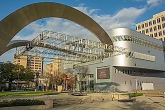Editorial Photo Credit: Nina Alizada via Shutterstock. Baton Rouge, USA - December 6, 2022 - Futuristic metallic exterior view of the new River Center Branch Library at North Blvd next to Bernardo de Galvez Plaza in downtown Baton Rouge