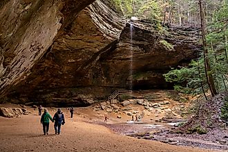 Tourists visit Ash Cave in the Hocking Hills State Park. Editorial credit: arthurgphotography / Shutterstock.com.