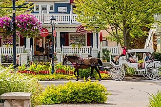 Horse-drawn carriage transports tourists in downtown Frankenmuth, Michigan. Image credit arthurgphotography via Shutterstock