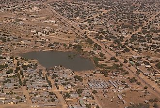 Aerial view to NDjamena and Chari River, Chad. Image credit homocosmicos via Adobe Stock. 