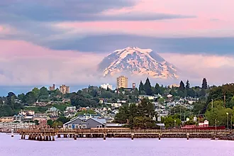Mount Rainier over Tacoma Washington waterfront during alpenglow sunset evening