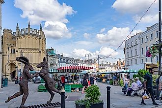 Sculptures and stalls during a market in the town of Cirencester, England. Editorial credit: Photos BrianScantlebury / Shutterstock.com