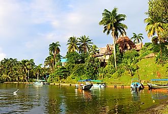 Resort on the Rio Dulce, the most famous and important river of Guatemala, Central America. Here, south of Livingston, it flows into the Gulf of Honduras in the Caribbean sea. Image credit Judith Lienert via Shutterstock.