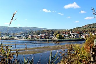 Town of La Malbaie in Quebec, with buildings set against a forested hillside