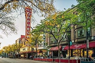 Iconic colorful tables and chairs overlooking sailboats on Lake Mendota at Union Terrace on the University of Wisconsin - Madison campus. Editorial credit: Koeppen Photo / Shutterstock.com