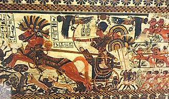 Tutankhamun charging enemies on his chariot, 18th dynasty.