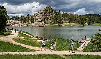 Families enjoy a summer day on Sylvan Lake in Custer State Park, South Dakota. Image credit: Melissamn / Shutterstock.com.