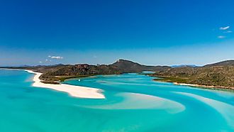 Editorial Photo Credit: GagliardiPhotography via Shutterstock. Hill Inlet Lookout. Whitehaven Beach in the Whitsundays, Queensland panoramic aerial view, Australia