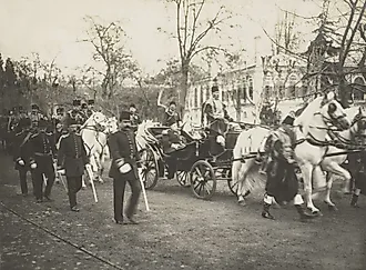 Ottoman Sultan Mehmed V in a carriage followed by the Young Turk Enver Pasha by Everett Collection via Shutterstock.com