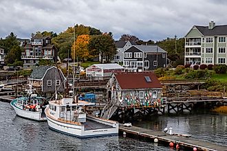 Boats parked at a marina on Badger's Island during a cloudy morning in Kittery, Maine, via EB Adventure Photography / Shutterstock.com