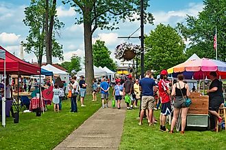 People are celebrating A Taste of Twinsburg in Twinsburg, Ohio. Image credit Kenneth Sponsler via Shutterstock