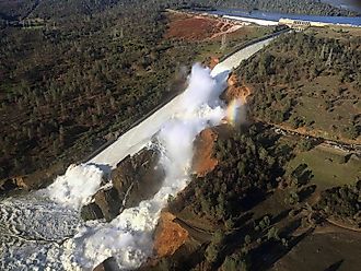 View of Oroville Dam's main spillway (center) and emergency spillway (top) collapsing. 