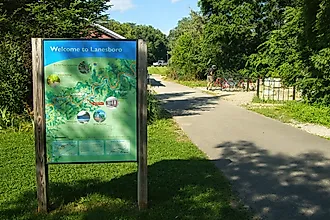 A Welcome to Lanesboro sign along the Root River Trail in Lanesboro, Minnesota. Editorial credit: Dave Jonasen / Shutterstock.com.