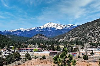 A panoramic view captures the snow-capped peak of Sierra Blanca, as seen from Ruidoso, New Mexico, 